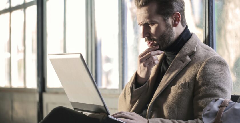 Professional searching for jobs online in Pakistan using a laptop while reviewing career opportunities and employment listings.